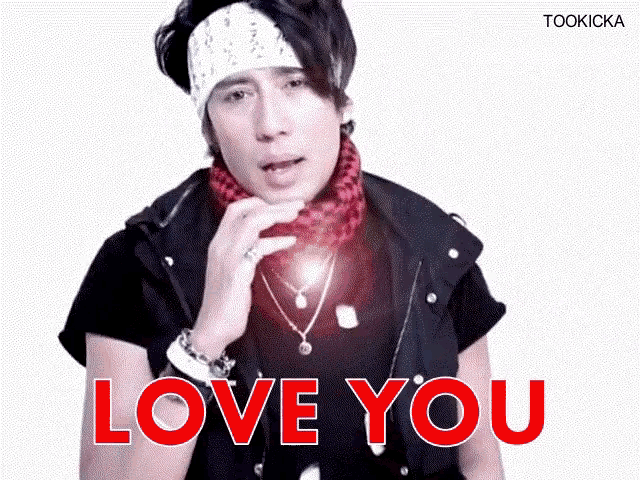 a man wearing a bandana and a vest says love you