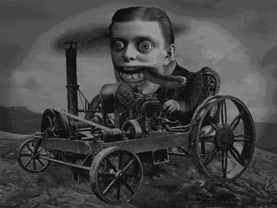 a black and white photo of a man with a long tongue riding a machine .