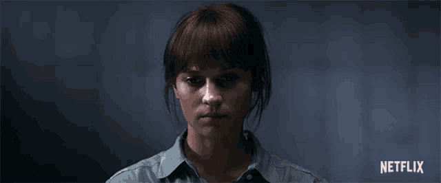 a close up of a woman 's face with the word netflix on the bottom