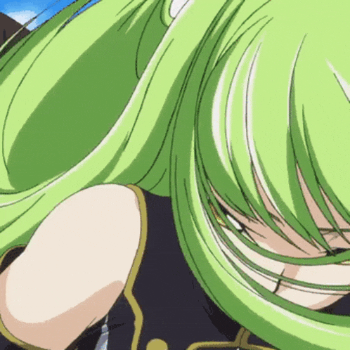 a close up of a girl with green hair and a black shirt