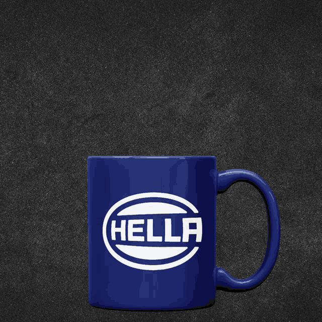 a blue coffee mug that says hella on it