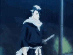 a person is holding a sword with the letter t on the handle