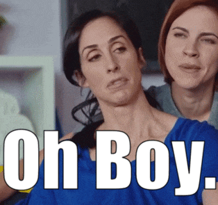 a woman in a blue shirt is standing next to another woman with the words oh boy on the bottom