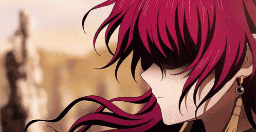 a close up of a person 's face with red hair and earrings