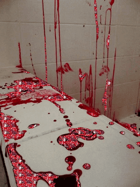 a bathroom with a lot of blood and glitter on the floor