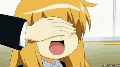 a person is touching a girl 's face with their hand .