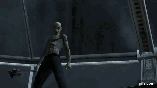 a man is holding a gun in a video game while surrounded by green triangles .