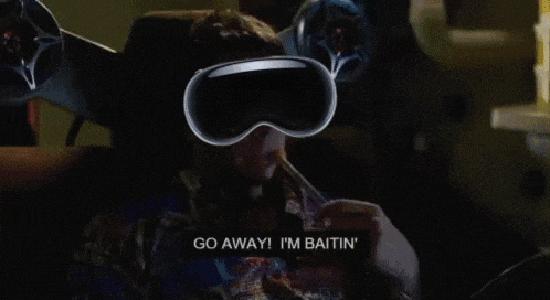 a man wearing a virtual reality headset says go away i 'm baitin