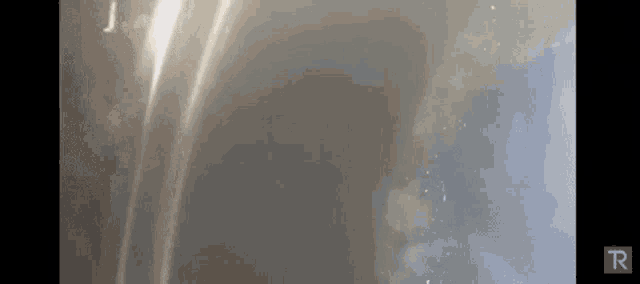 a gray background with a blue r on the bottom