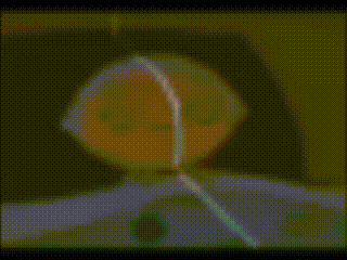 a blurred image of a person 's face with a clock on it that shows the time as 10:10