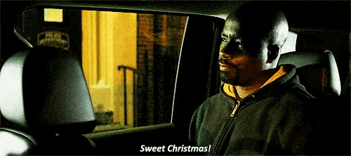 a man in a car says sweet christmas while looking out of the window