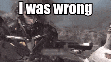 a man holding a gun with the words i was wrong above him