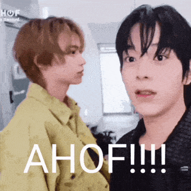 two young men are standing next to each other and one of them is saying ahof