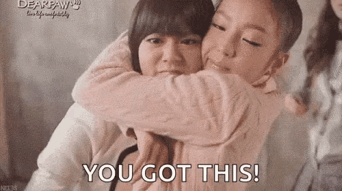 a couple of girls hugging each other with the words `` you got this '' written on the bottom .