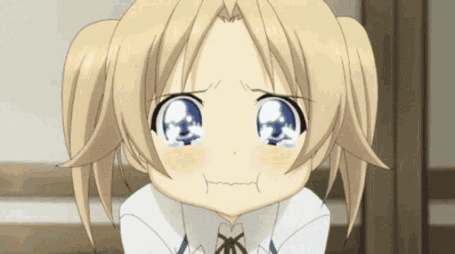 a little girl with blonde hair and blue eyes is making a sad face