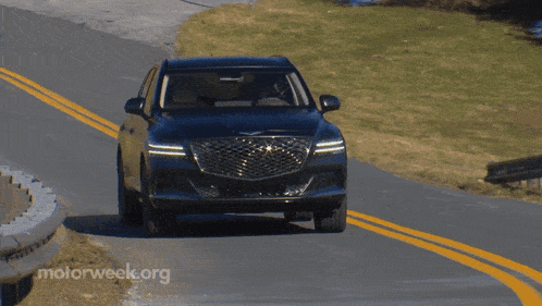 a car is driving down a road with motorweek.org written on the bottom right