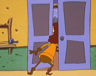 a cartoon character is standing in front of a purple door .