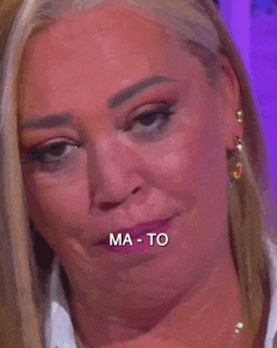 a close up of a woman 's face with the words `` ma-to '' written on it .