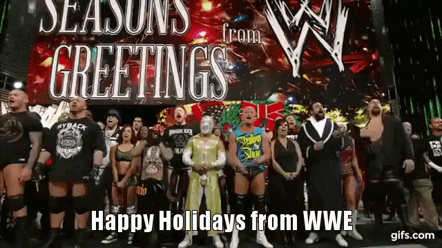 a group of wrestlers are standing in front of a sign that says season 's greetings happy holidays from wwe