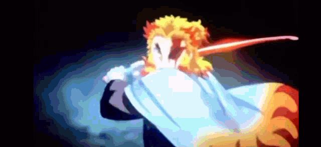 a close up of a person holding a sword and a cape .