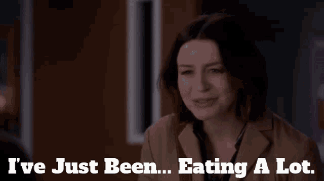 a woman in a trench coat says i 've just been eating a lot