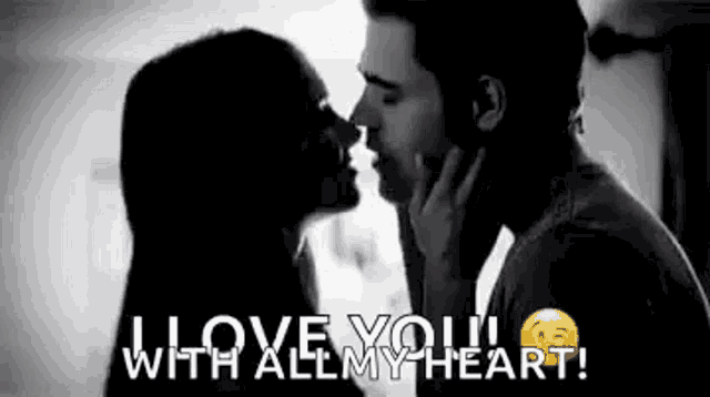 a man and a woman are kissing in a black and white photo with the words `` i love you with all my heart '' .
