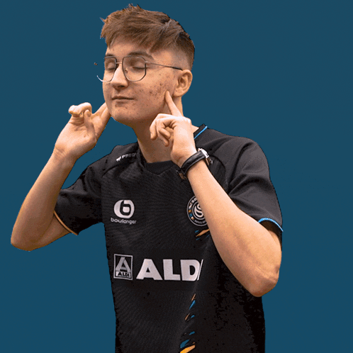 a man in a black shirt points at the camera with the word ratio below him