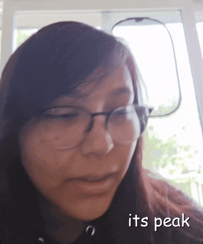 a woman wearing glasses and headphones with the words its peak below her