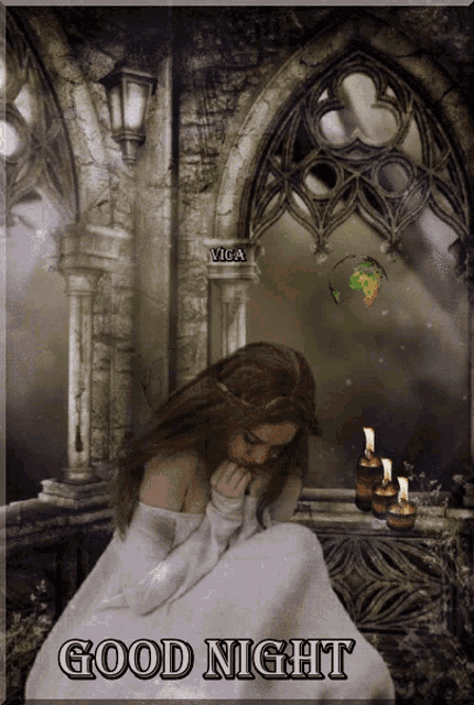 a woman in a white dress is sitting in front of candles and a sign that says good night