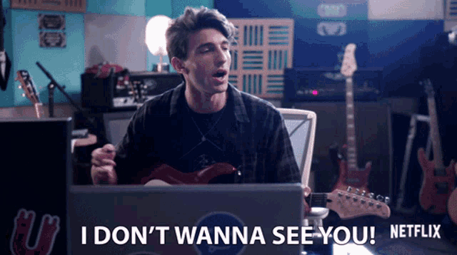 a man playing a guitar with the words i don t wanna see you