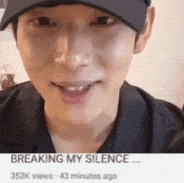 a close up of a man wearing a hat and smiling with the caption `` breaking my silence '' .