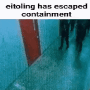 a group of people are walking down a hallway with a door .