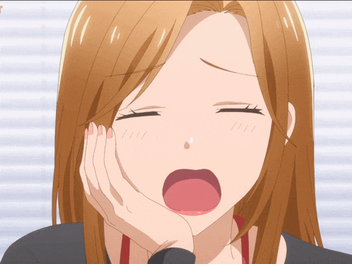 a close up of a girl yawning with her mouth open