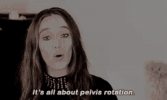 a woman is talking about pelvis rotation while wearing a black top .