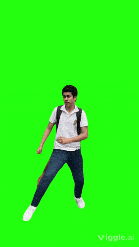 a boy with a backpack is jumping in the air