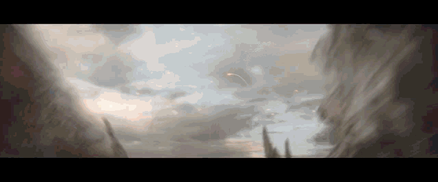 a rocket is flying through a cloudy sky above a building