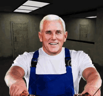 a man in blue overalls and a white shirt is smiling