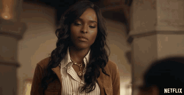 a woman in a brown jacket and striped shirt is featured in a netflix ad