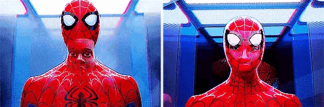 a close up of a spider-man in a red suit with a spider on his chest