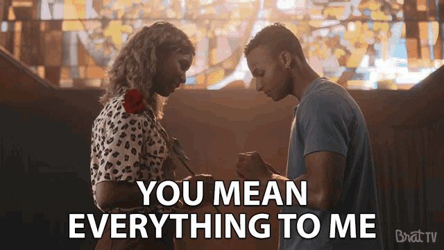 a man giving a rose to a woman with the words " you mean everything to me " above them