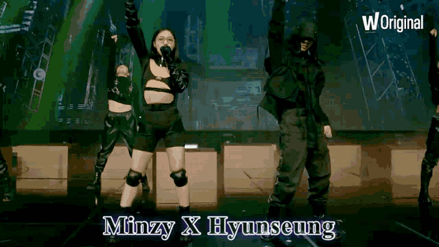 a woman singing into a microphone with the words minzy x hyunseung written below her