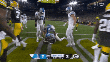 a football game is being played with a score of 7 to 3