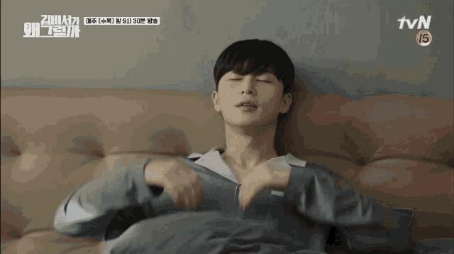 a man laying on a couch with tvn written on the bottom right