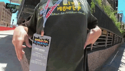 a person wearing a lanyard that says game on expo
