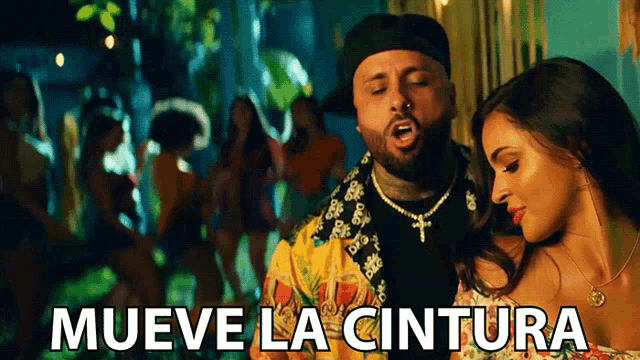 a man and a woman are standing next to each other with the words mueve la cintura written below them