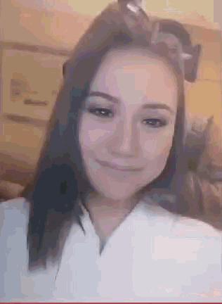a close up of a woman 's face with a blurred background