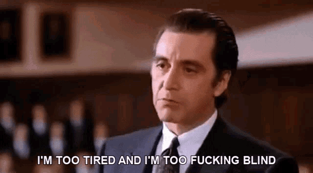 a man in a suit and tie is saying i 'm too tired and i 'm too fucking blind