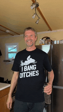 a man wearing a t-shirt that says " i bang ditches "