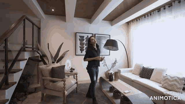 a woman is standing in a living room with a couch and stairs made by animatica