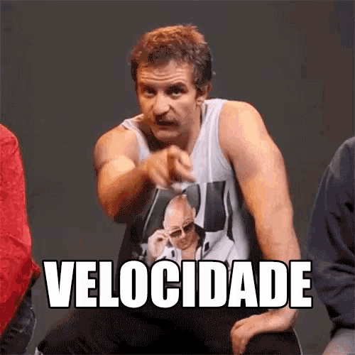 a man wearing a tank top with a picture of a man and the word velocidade written on it